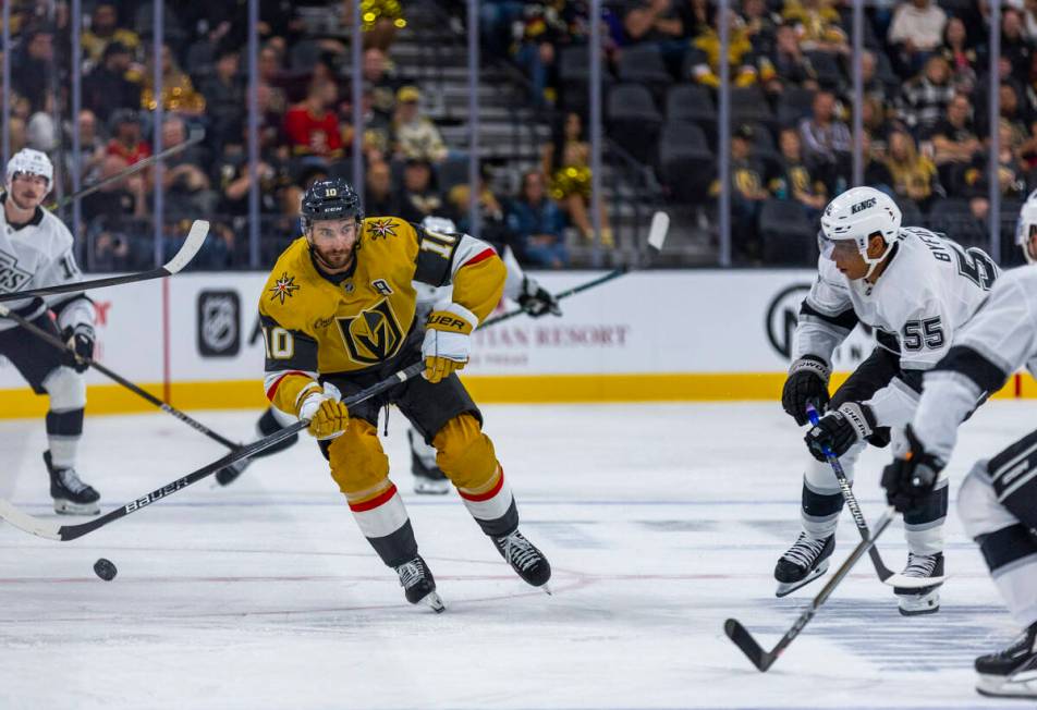 Golden Knights center Nicolas Roy (10) looks to advance the puck against Los Angeles Kings righ ...