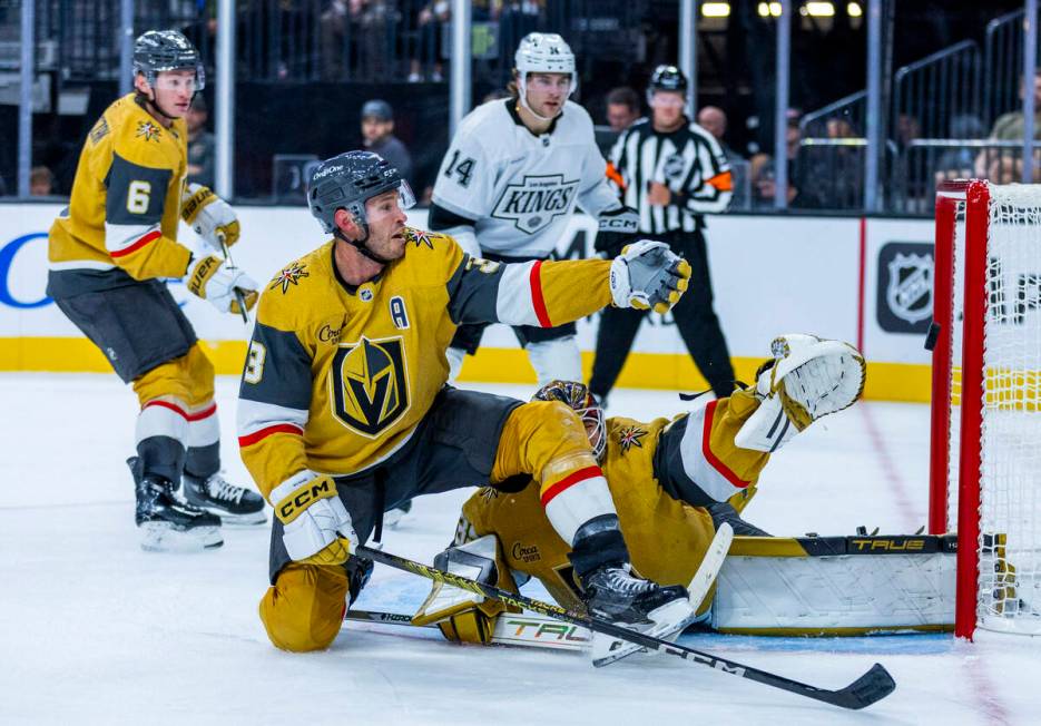 Golden Knights defenseman Brayden McNabb (3) and goaltender Ilya Samsonov (35) watch a shot hea ...