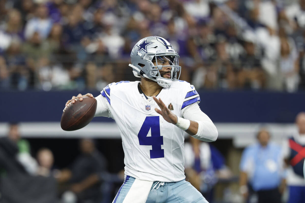 Dallas Cowboys quarterback Dak Prescott (4) looks to pass during an NFL football game against t ...