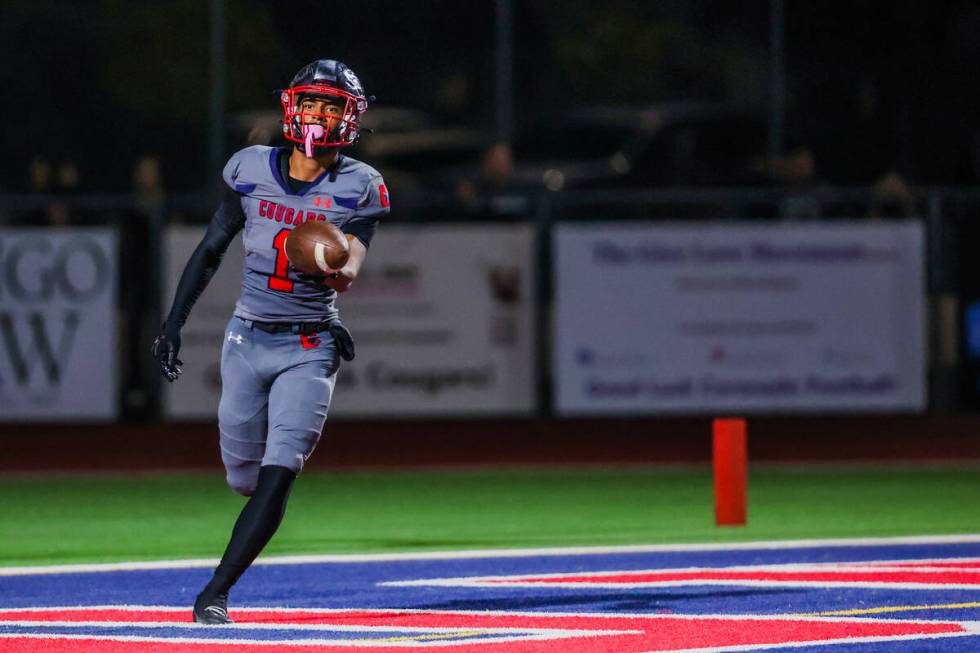 Coronado athlete Marquesion Floyde runs into the end zone for a touchdown during a football gam ...