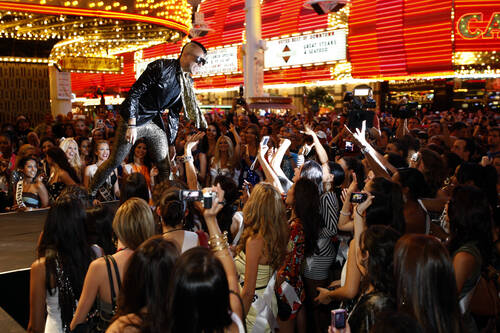 Neon Trees lead singer Tyler Glenn entertains the crowd during a concert at the Fremont Street ...