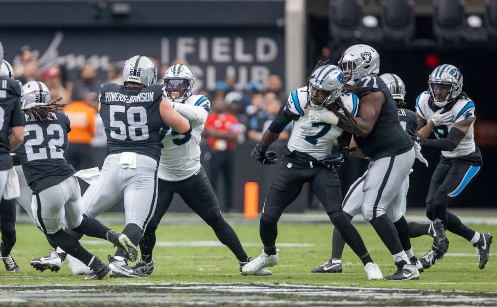 Raiders guard Jackson Powers-Johnson (58) and Raiders offensive tackle DJ Glaze (71) block agai ...