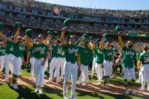 Oakland Athletics players acknowledge their fans after playing their final home game against th ...