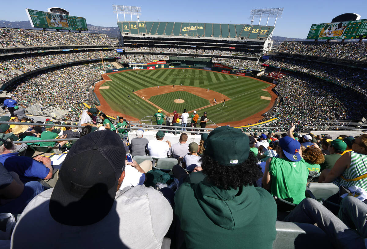 Fans watch Oakland Athletics final home game against the Texas Rangers at Oakland Coliseum, on ...