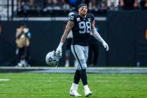 Raiders defensive end Maxx Crosby (98) walks off the field after another Carolina Panthers scor ...