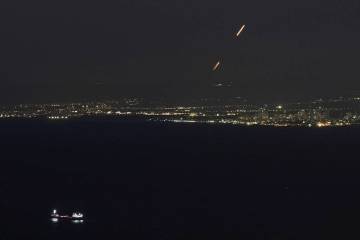 Israeli Iron Dome air defense system fires to intercept rockets that were launched from Lebanon ...