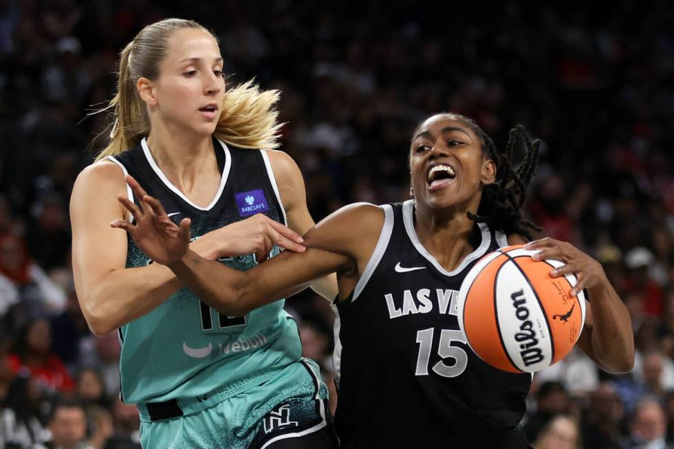 Las Vegas Aces guard Tiffany Hayes (15) drives toward the hoop against New York Liberty guard I ...