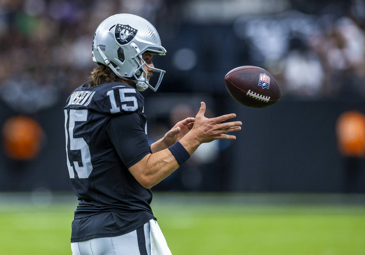 Raiders quarterback Gardner Minshew (15) looks in the ball during the first half of their NFL g ...