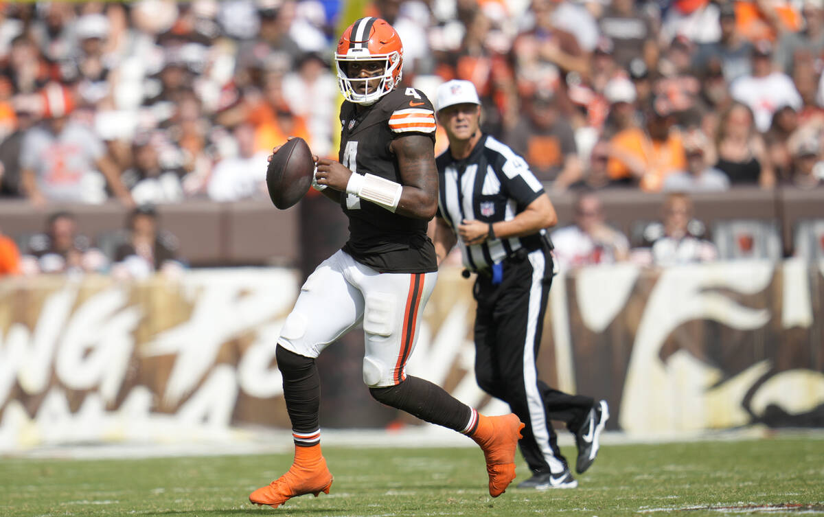 Cleveland Browns quarterback Deshaun Watson (4) scrambles during an NFL football game against t ...