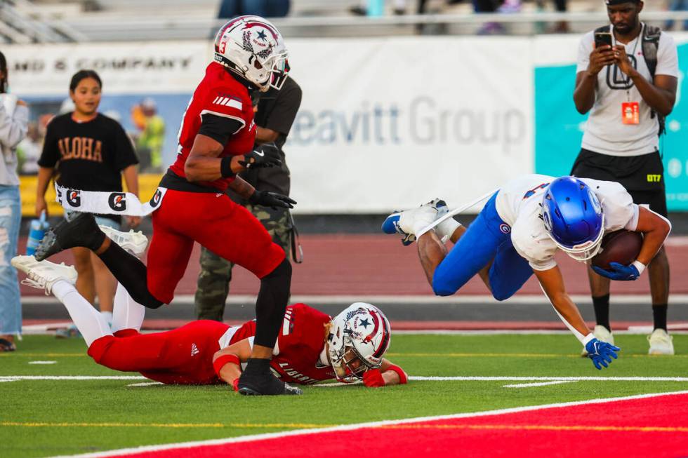 Bishop Gorman running back Myles Norman (24) leaps into the end zone for a touchdown during a h ...