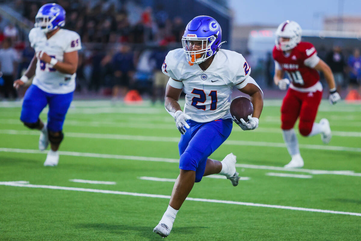 Bishop Gorman running back Jonathan Coar (21) runs the ball towards the end zone during a high ...