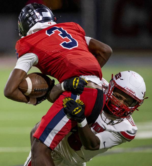 Arbor View senior Kent Bell III (8) attempts to tackle Coronado junior Ty Tinner (3) during the ...