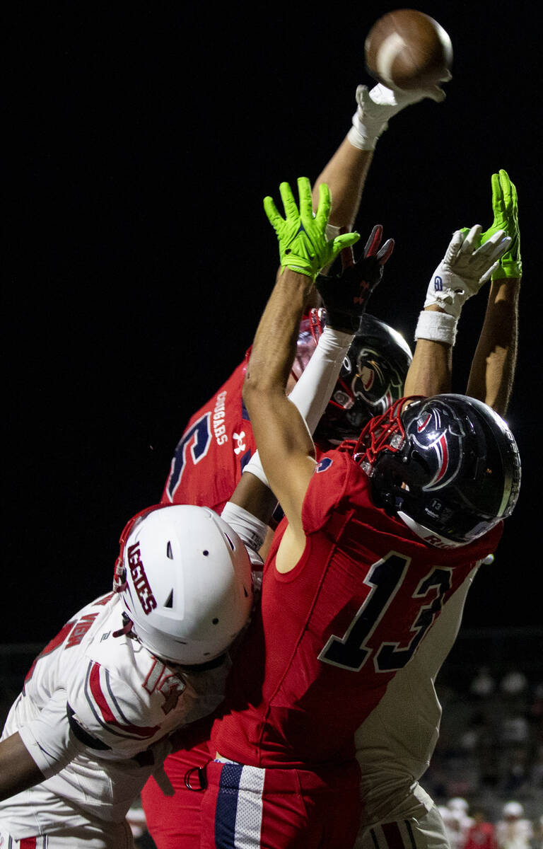 Coronado and Arbor View players jump for the ball during the high school football game at Coron ...