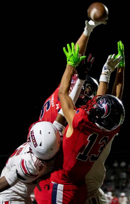 Coronado and Arbor View players jump for the ball during the high school football game at Coron ...