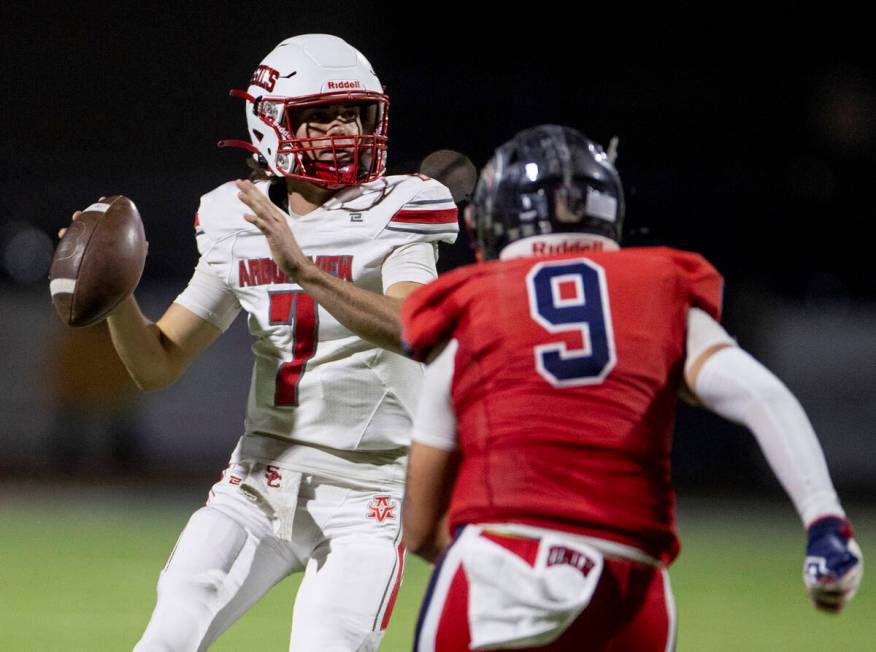 Arbor View quarterback Thaddeus Thatcher (7) looks to throw the ball during the high school foo ...