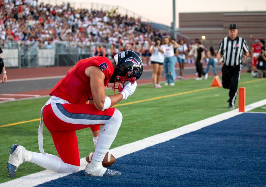 Coronado senior JJ Buchanan (6) kneels after scoring a touchdown during the high school footbal ...