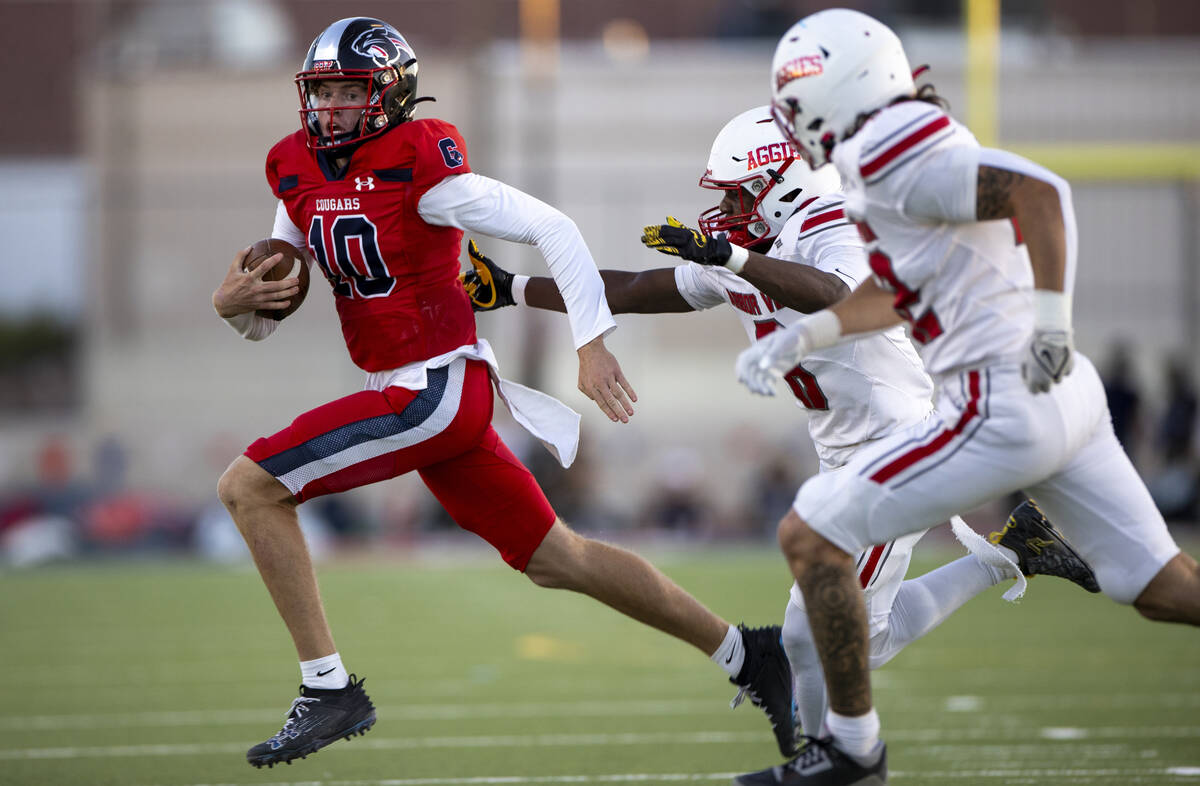 Coronado quarterback Aiden Krause (10) avoids Arbor View defenders during the high school footb ...