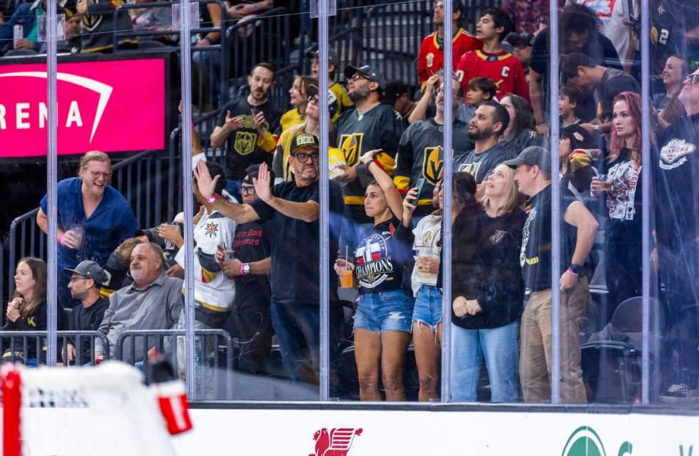 Golden Knights fans celebrate a score against Utah Hockey Club goaltender Jaxson Stauber (33) d ...