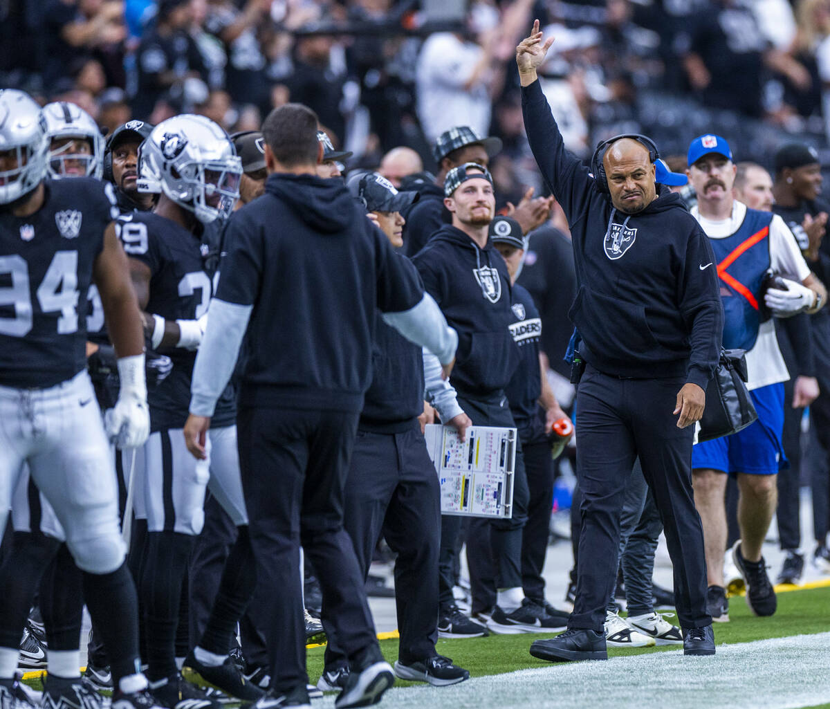 Raiders Head Coach Antonio Pierce signals the crowd to get louder against the Carolina Panthers ...