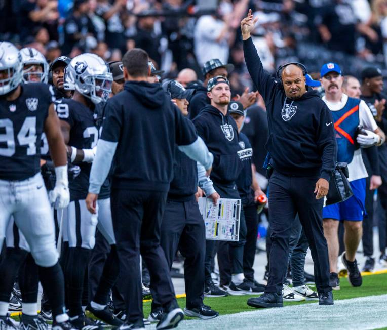 Raiders Head Coach Antonio Pierce signals the crowd to get louder against the Carolina Panthers ...