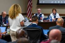 Regent Byron Brooks, center, has both American and Israeli flags about his nameplate during NSH ...