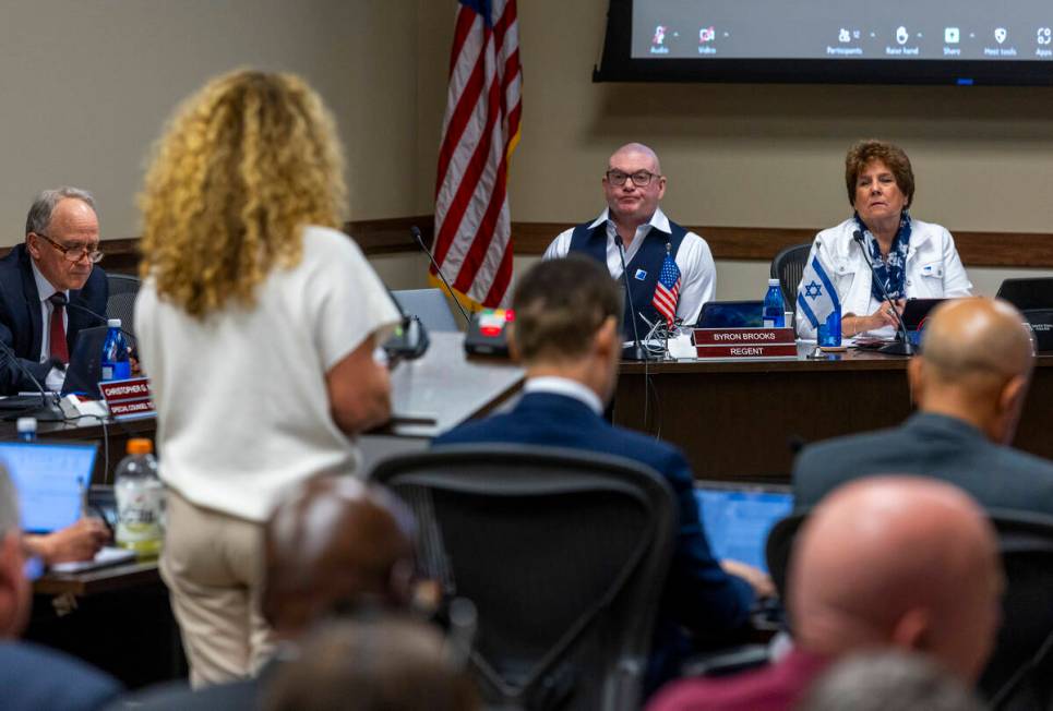 Regent Byron Brooks, center, has both American and Israeli flags about his nameplate during NSH ...