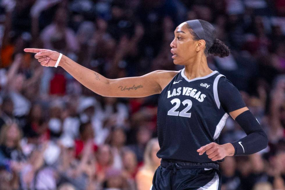 Aces center A'ja Wilson (22) signals her teammate during the first half of their WNBA playoffs ...