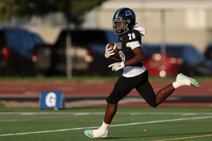 Desert Pines running back Marcus Williams (20) runs toward the end zone before scoring during t ...