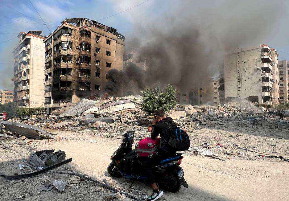 Smoke rises at the site of Israeli airstrikes in Beirut's southern suburbs, Saturday, Sept. 28, ...