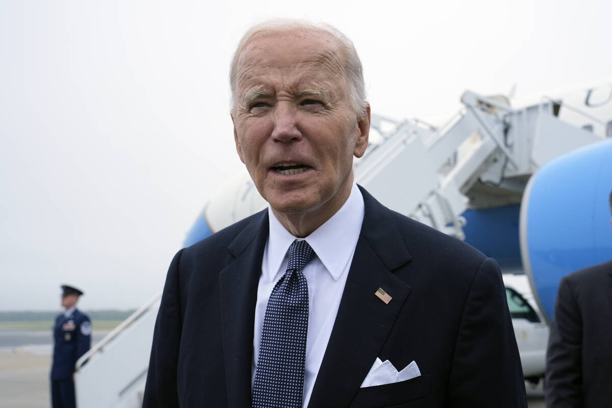 President Joe Biden speaks the the media after stepping off Air Force One at Dover Air Force Ba ...