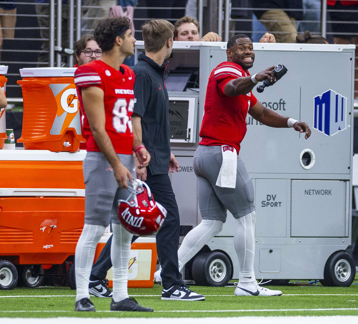 UNLV quarterback Hajj-Malik Williams (6) jokes with teammates as the game winds down against th ...