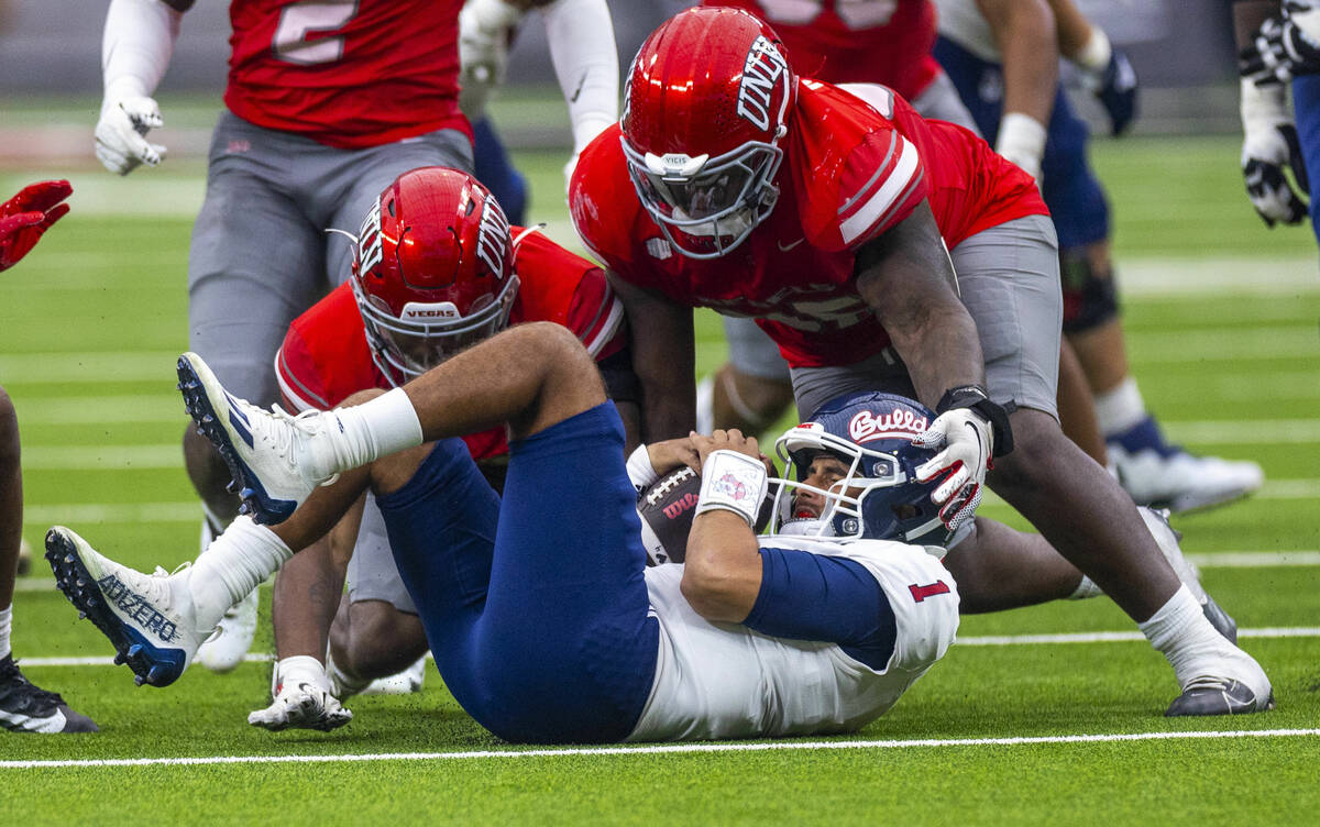 Fresno State Bulldogs quarterback Mikey Keene (1) recovers a loose ball but loses yardage as th ...