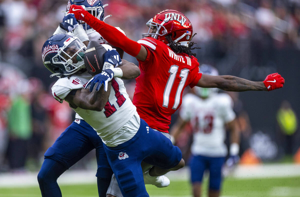 Fresno State Bulldogs defensive back Jayden Davis (11) intercepts a pass intended for UNLV wide ...