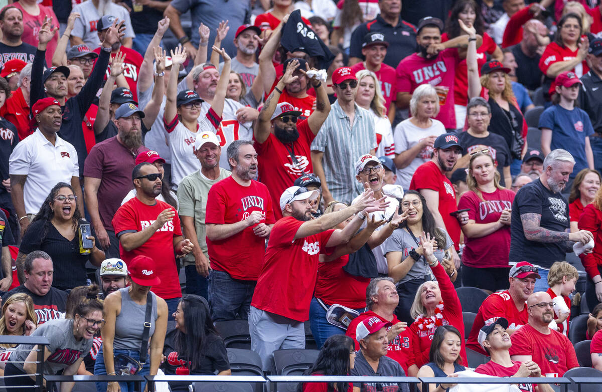 UNLV fans reach for free t-shirts as they blow out Fresno State Bulldogs during the second half ...