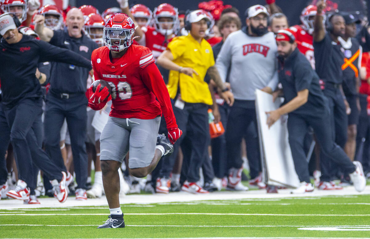 UNLV defensive lineman Keith Conley Jr. (99) almost goes the distance on a possible fumble agai ...