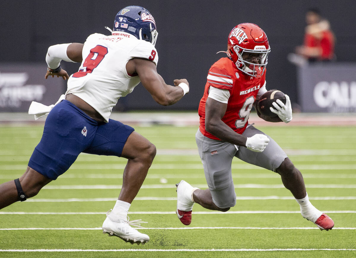 UNLV running back Jai'Den Thomas (9) runs the ball during the college football game against Fre ...