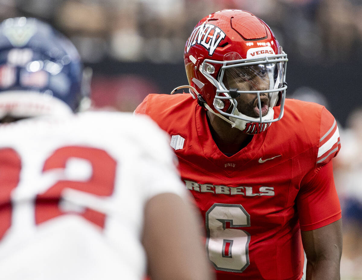 UNLV quarterback Hajj-Malik Williams (6) calls a play during the college football game against ...