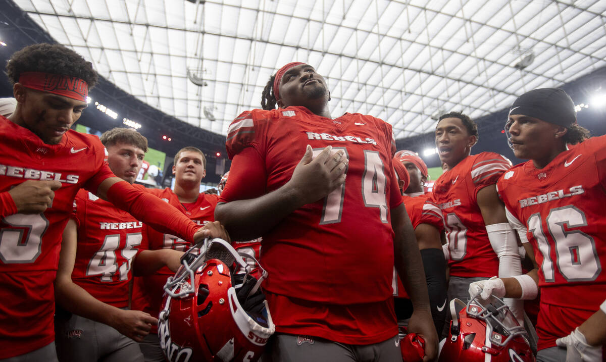 UNLV offensive lineman Jalen St. John (74) dances with his teammates after defeating Fresno Sta ...