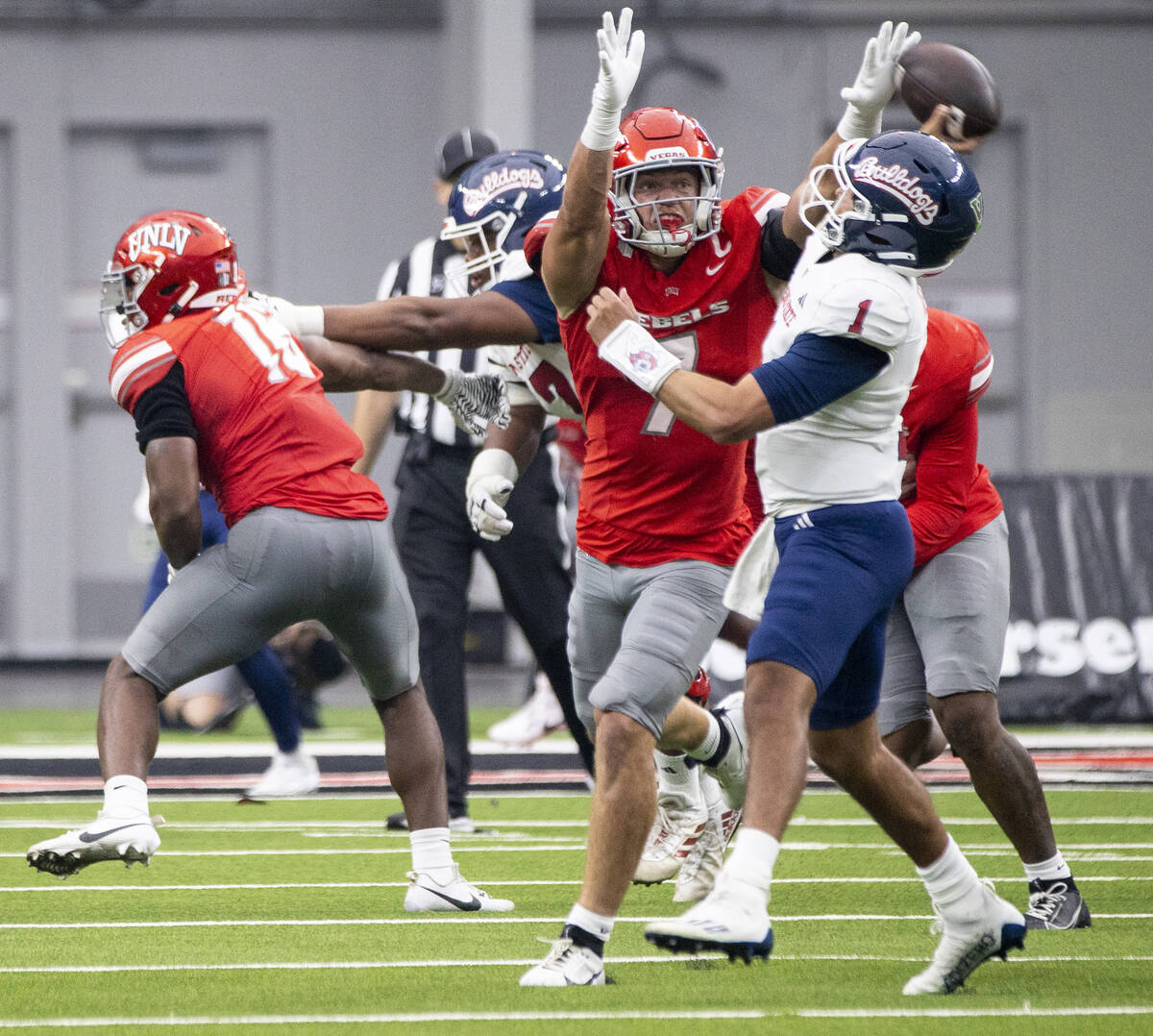 UNLV linebacker Jackson Woodard (7) blocks a pass from Fresno State quarterback Mikey Keene (1) ...