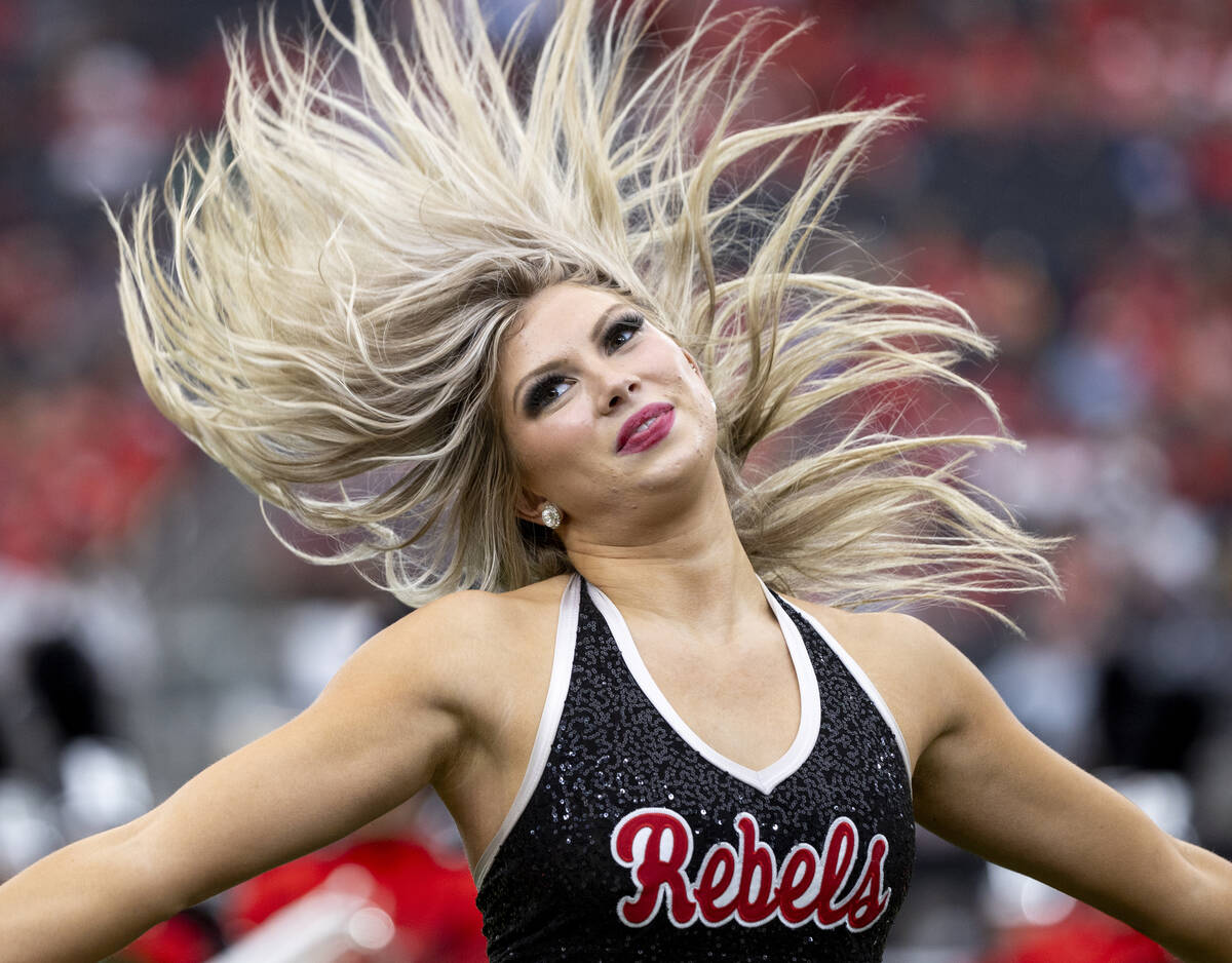 A member of the Scarlet Dance Line dances before the college football game between UNLV and Fre ...