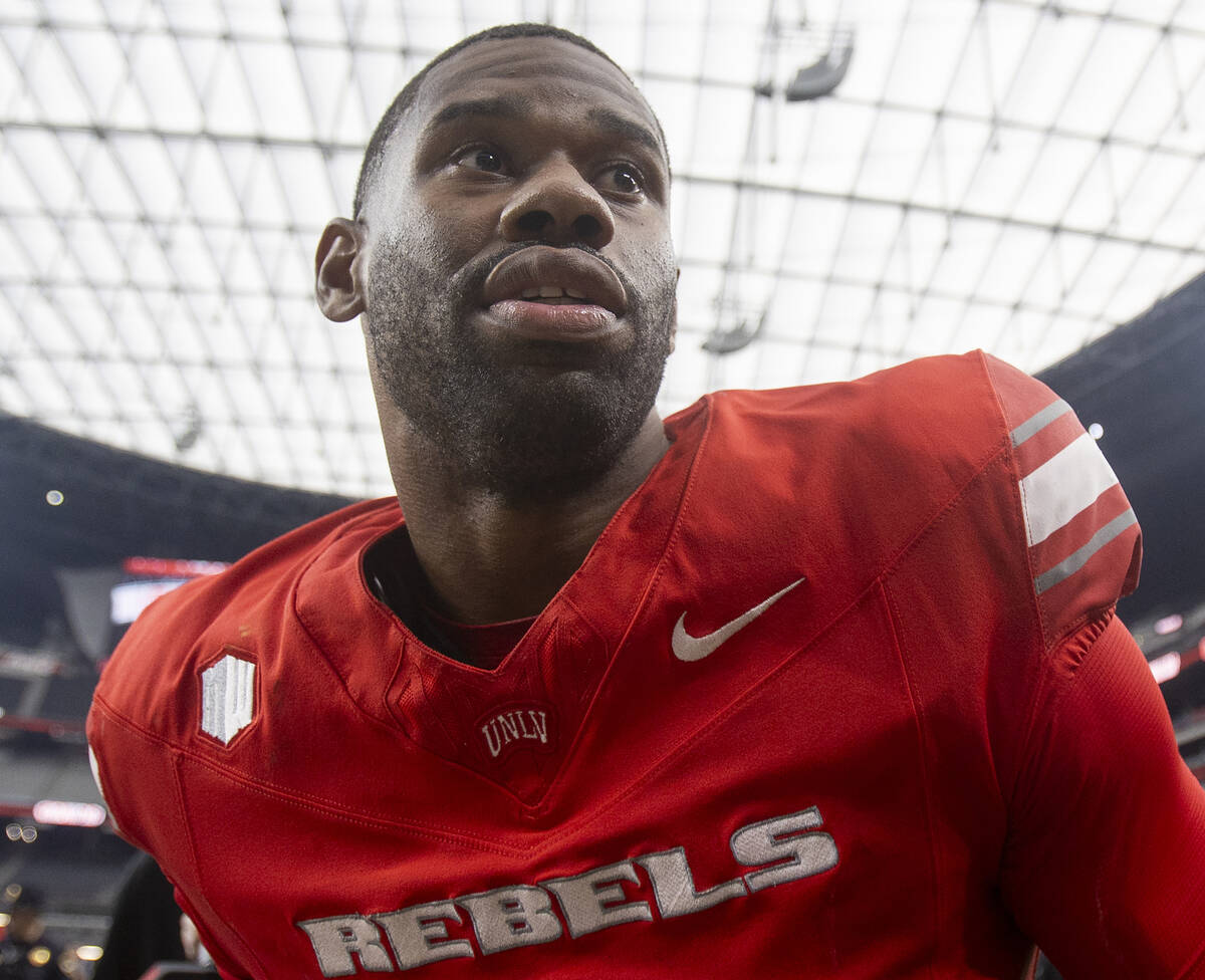 UNLV quarterback Hajj-Malik Williams (6) walks off the field after defeating Fresno State 59-14 ...