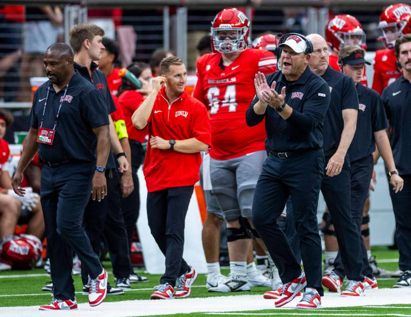 UNLV head coach Barry Odom keeps his players motivated after a score against the Fresno State B ...