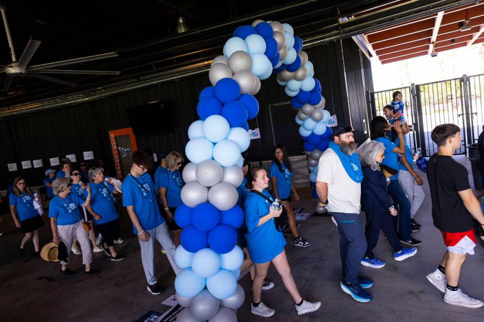 People participate in the Anti-Defamation League's Walk Against Hate at Las Vegas Ballpark in D ...