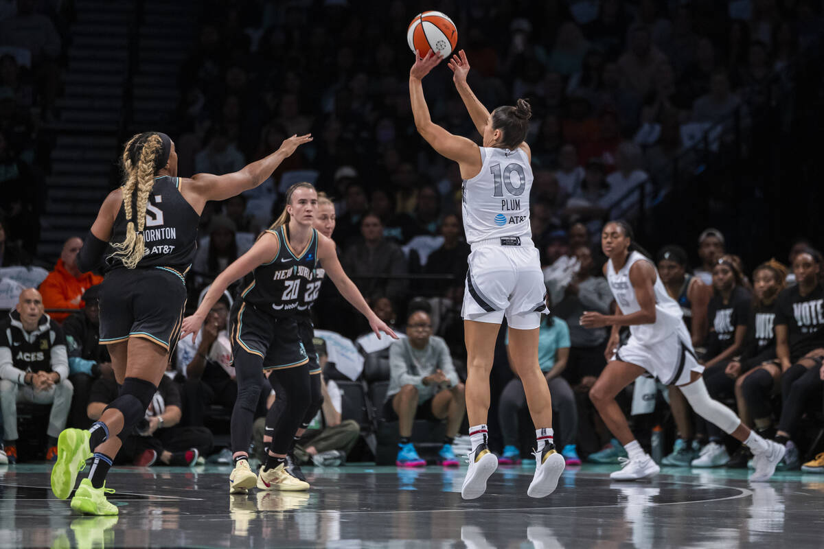 Las Vegas Aces guard Kelsey Plum (10) shoots a 3 point basket during the first half of a WNBA b ...