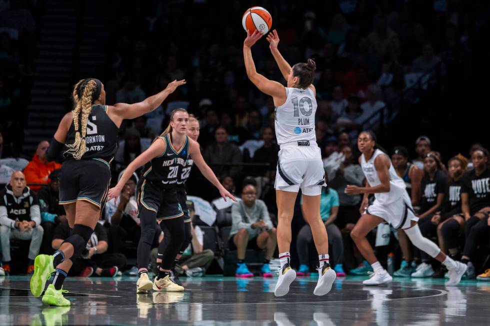 Las Vegas Aces guard Kelsey Plum (10) shoots a 3 point basket during the first half of a WNBA b ...