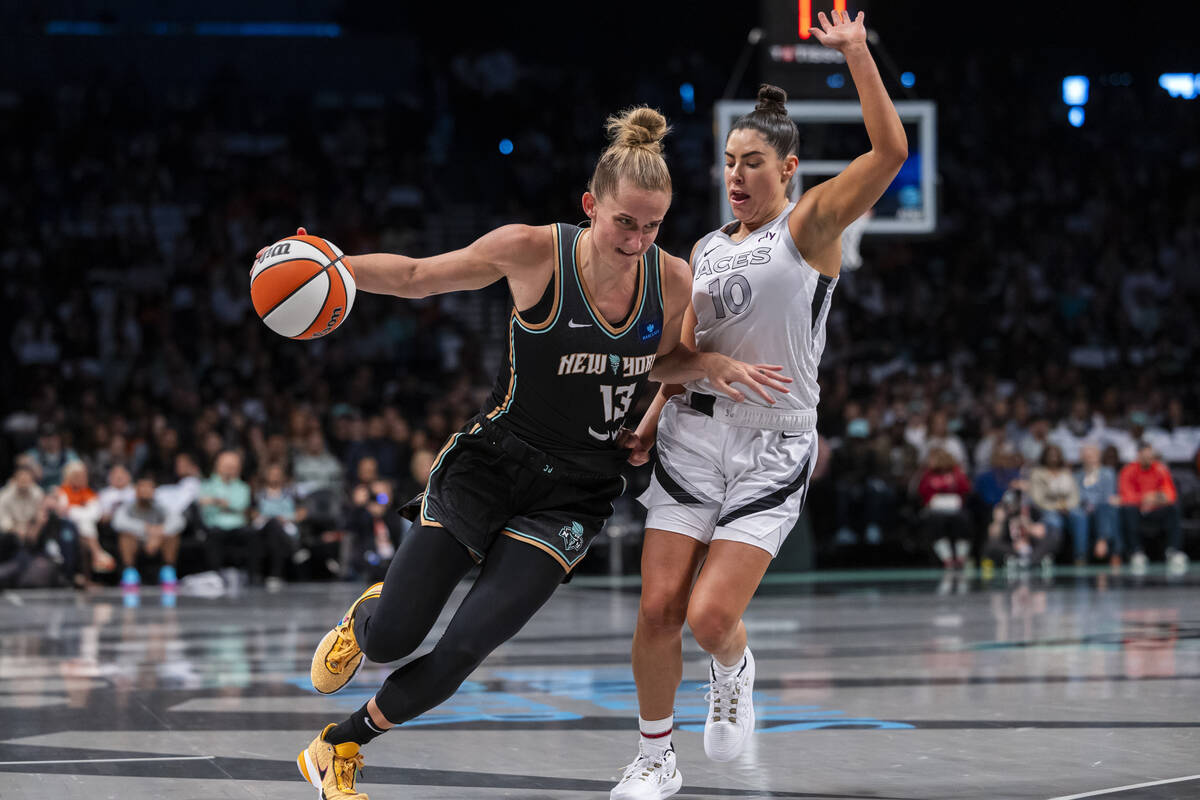 New York Liberty forward Leonie Fiebich (13) is defended by Las Vegas Aces guard Kelsey Plum (1 ...