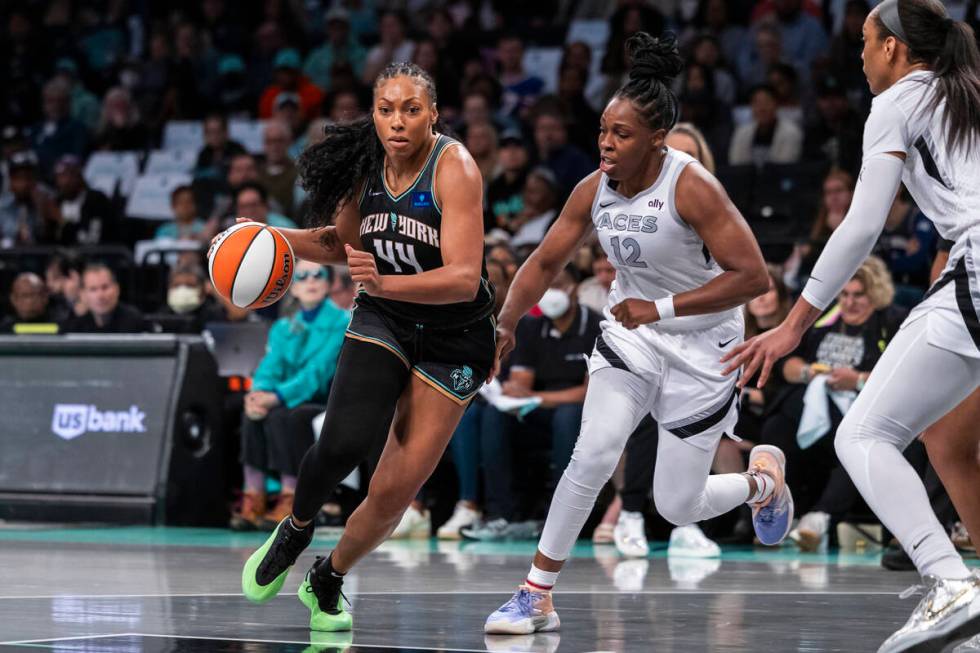 New York Liberty forward Betnijah Laney-Hamilton (44) is defended by Las Vegas Aces guard Chels ...