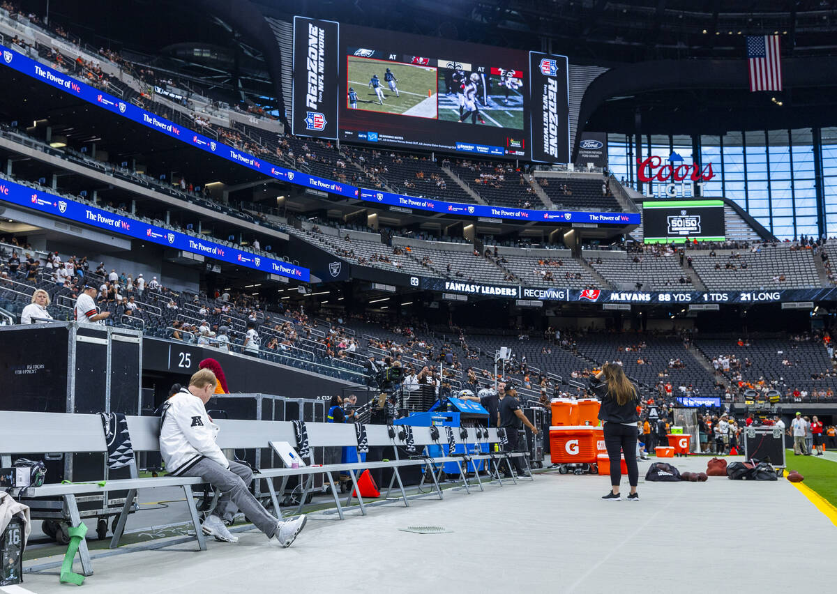 Raiders owner Mark Davis watches the Aces game from the bench during the warm ups of their NFL ...