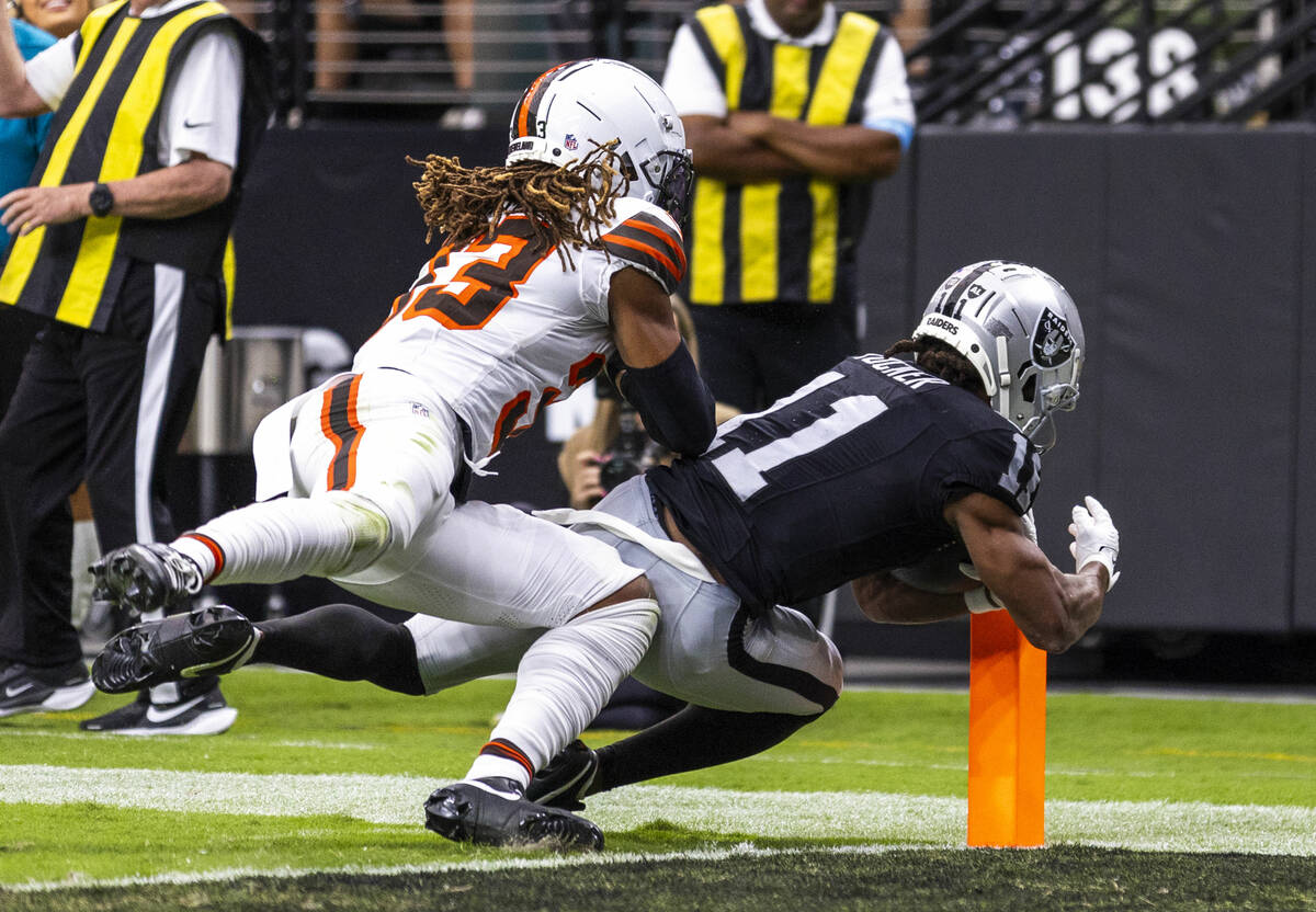 Raiders wide receiver Tre Tucker (11) gets into the end zone for a score over Cleveland Browns ...