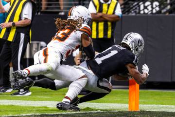 Raiders wide receiver Tre Tucker (11) gets into the end zone for a score over Cleveland Browns ...